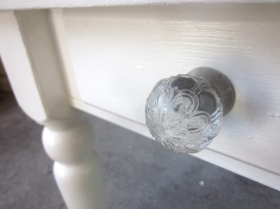 22. Put a decorative knob on the drawer to give this herringbone table project a finished look