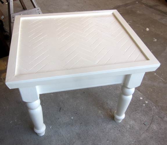 19. Once decorative trim is in place paint one more final coat of paint, three coats total on the tabletop itself